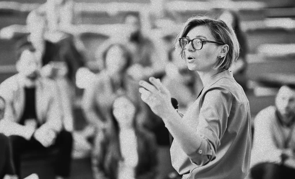 woman speaking to a group of people